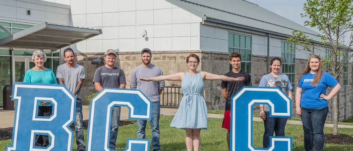 8 students on BCTC's campus. They are holding big letters: B C T C