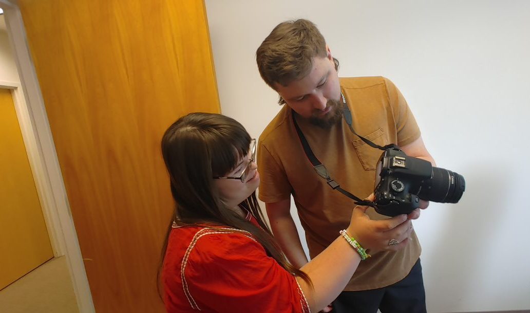 Adam and Ann work on a photo shoot together.