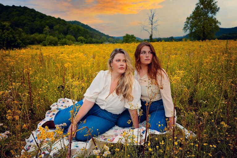 Two women in a field of goldenrod