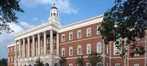 Western Kentucky University campus photo of a red brick building with white columns