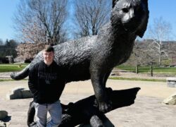 Justin in front of UK Wildcat statue