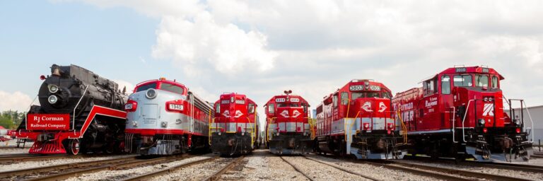 Six trains are on the tracks facing the camera.